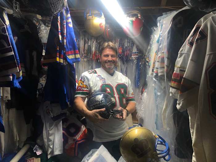 Chris Blaine poses with some of his World League memorabilia